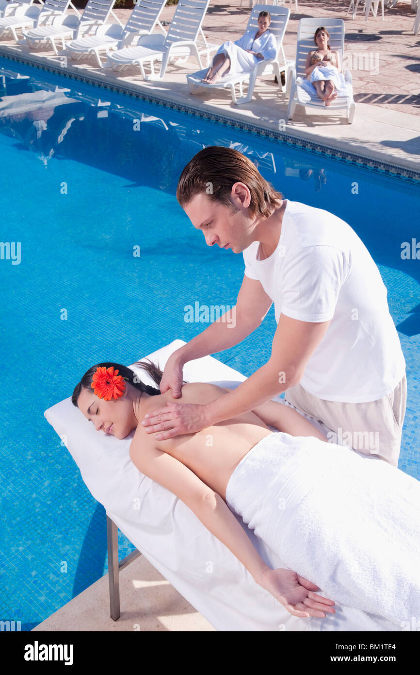 Woman receiving back massage from a massage therapist Stock Photo