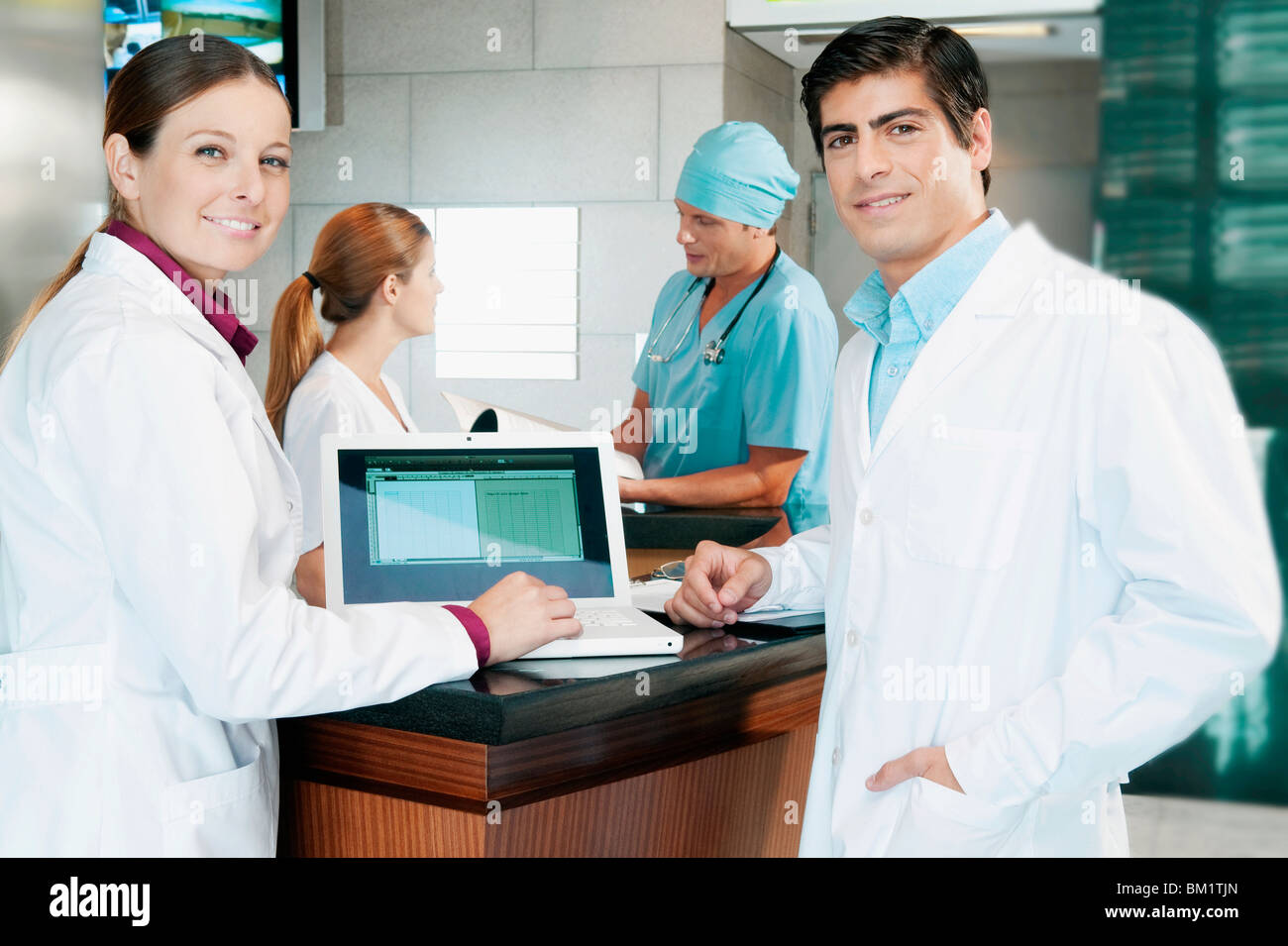 Two male doctors examining laptop hi-res stock photography and images ...