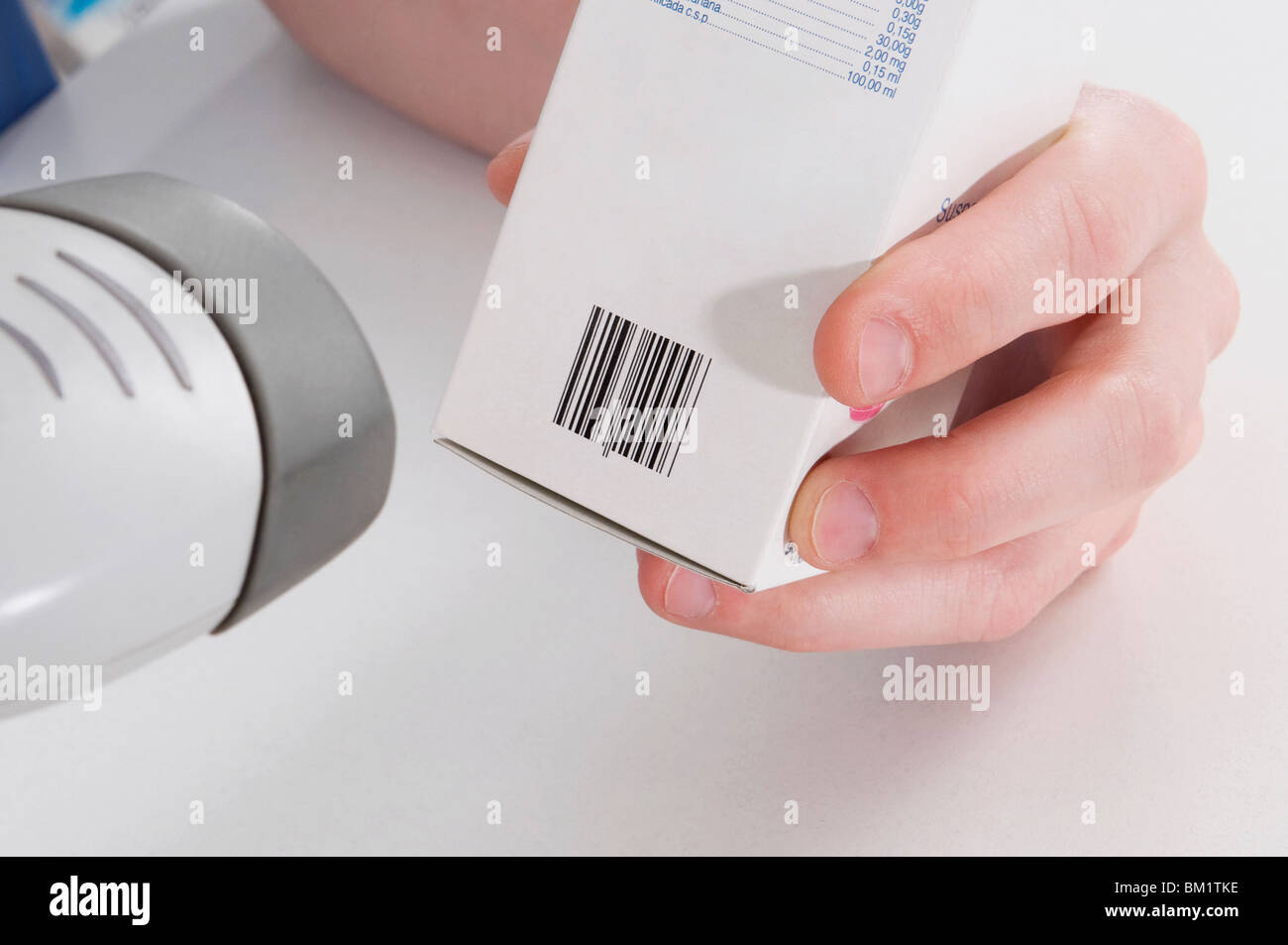 Pharmacist scanning a medicine with a bar code reader Stock Photo Alamy