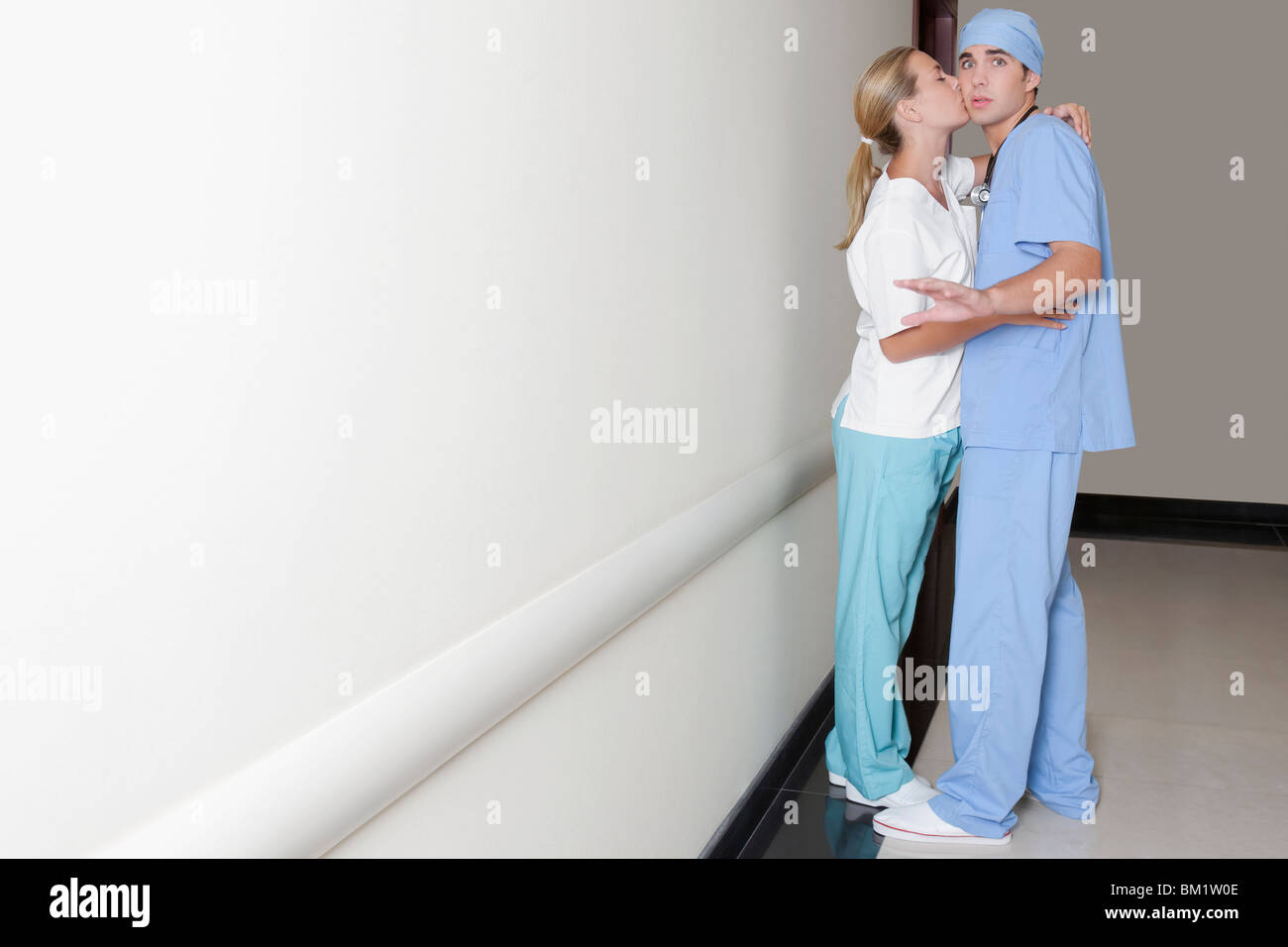 Male doctor flirting female nurse hires stock photography and images