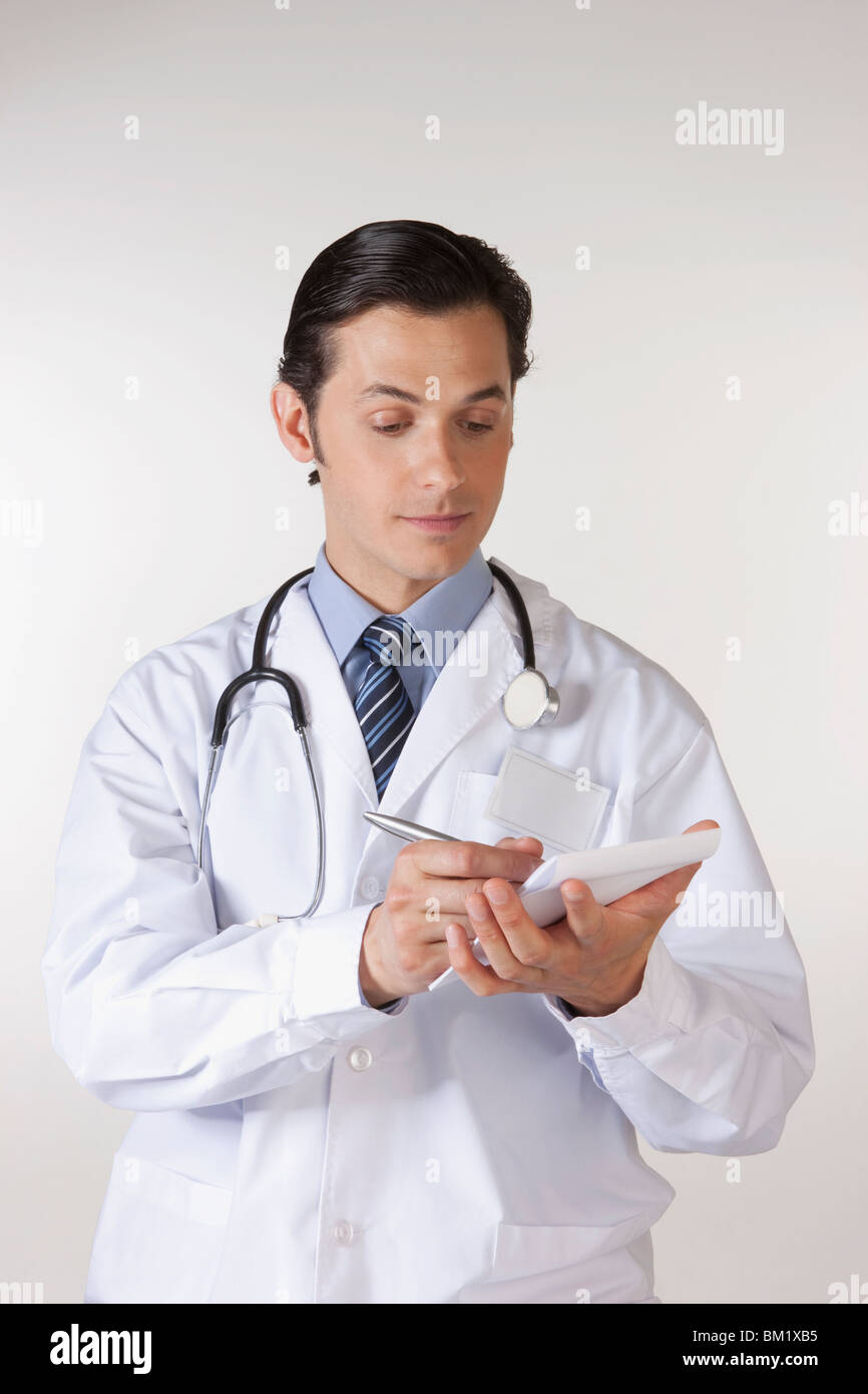 Doctor writing a prescription Stock Photo Alamy