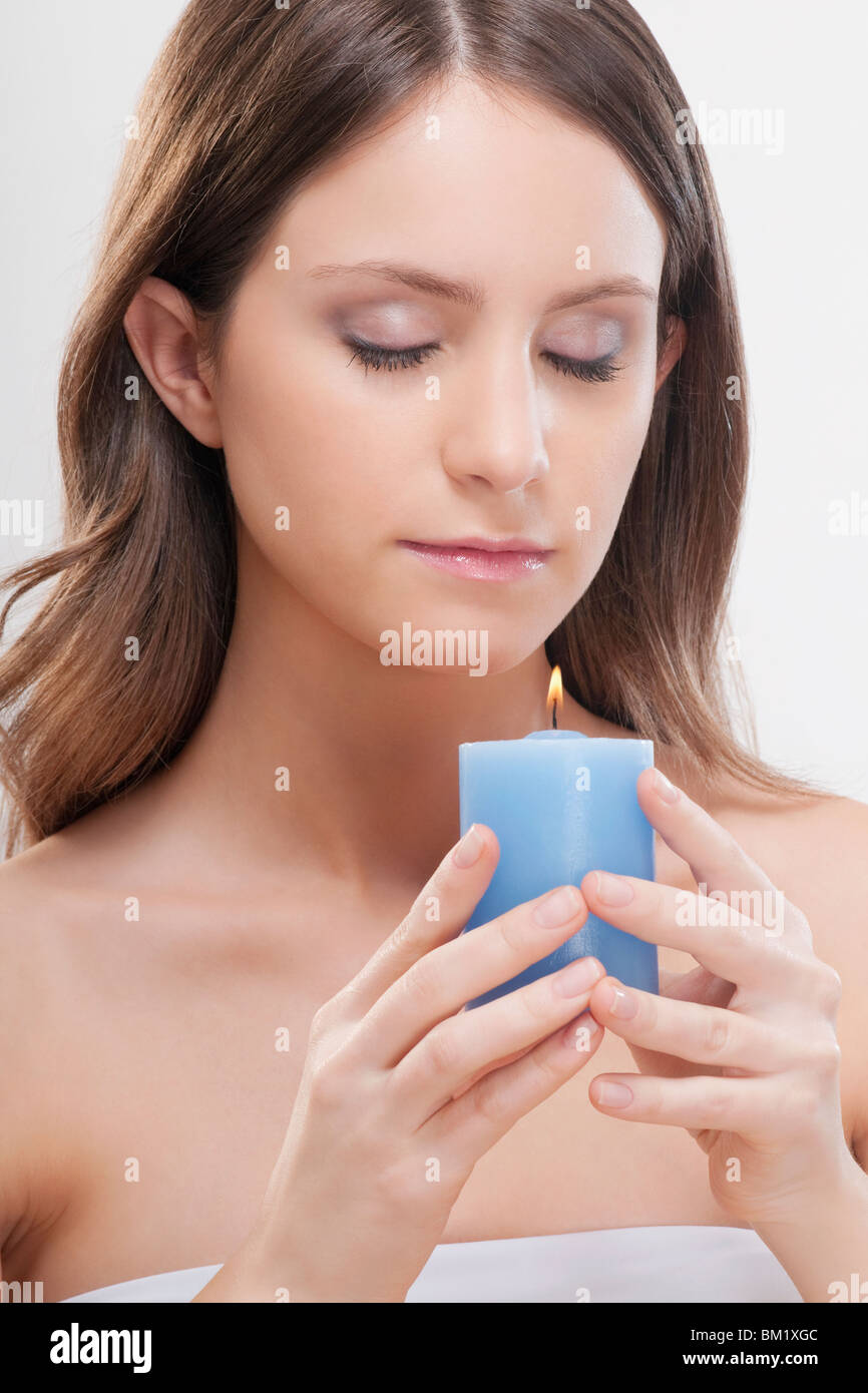 Woman holding a candle Stock Photo