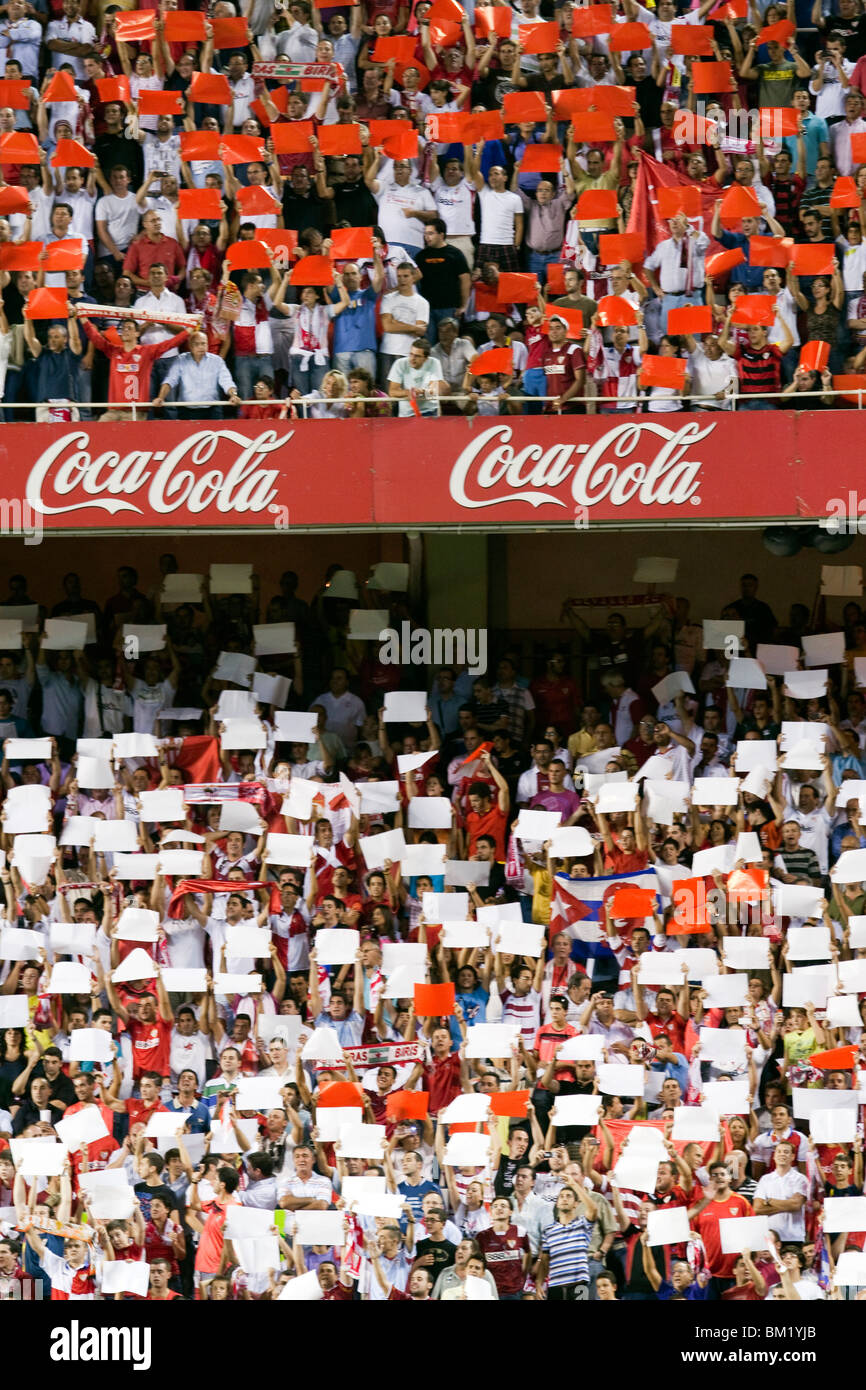 Sevilla FC fans doing a tifo with colored cards. Stock Photo