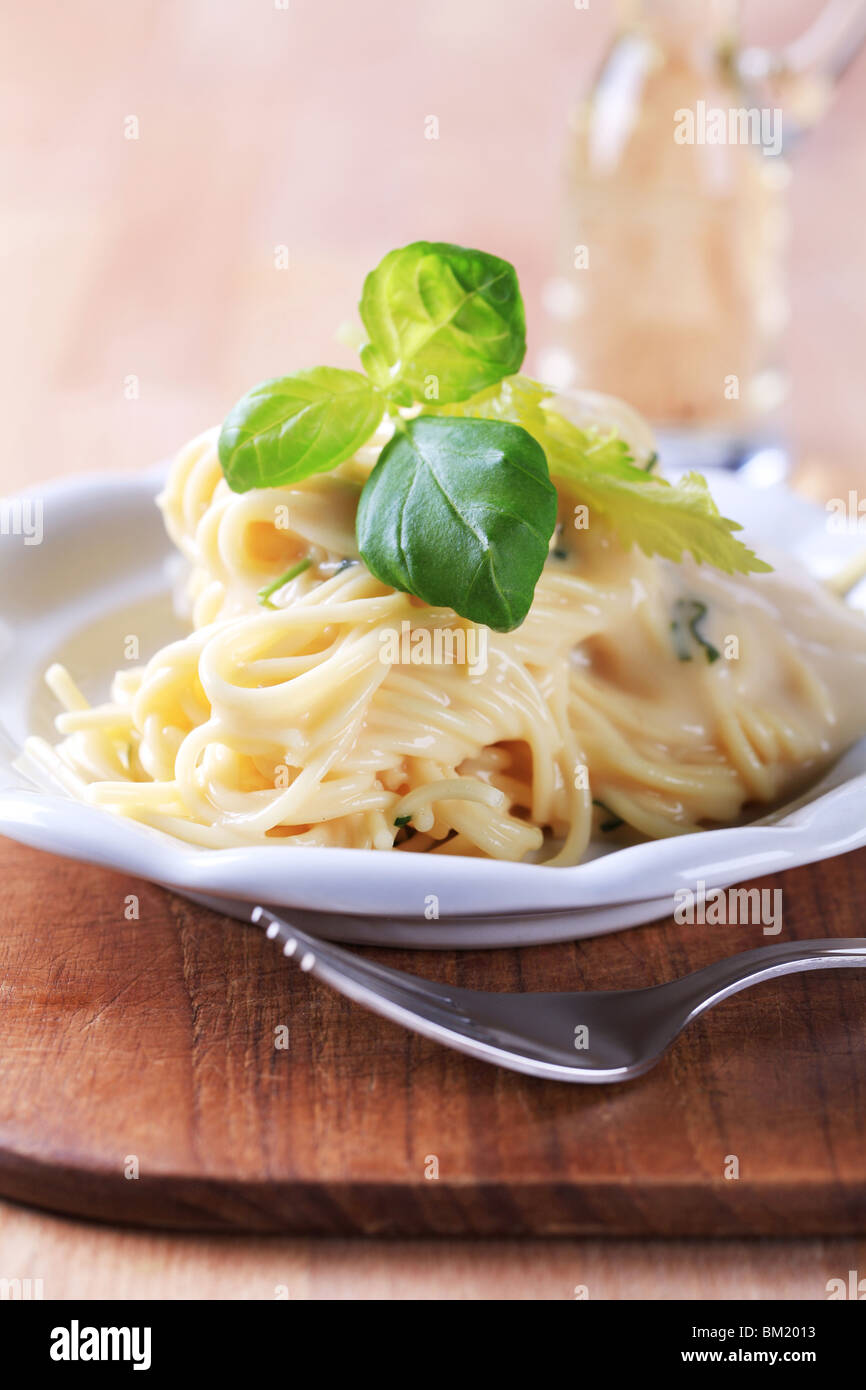Portion of spaghetti with cheese sauce Stock Photo