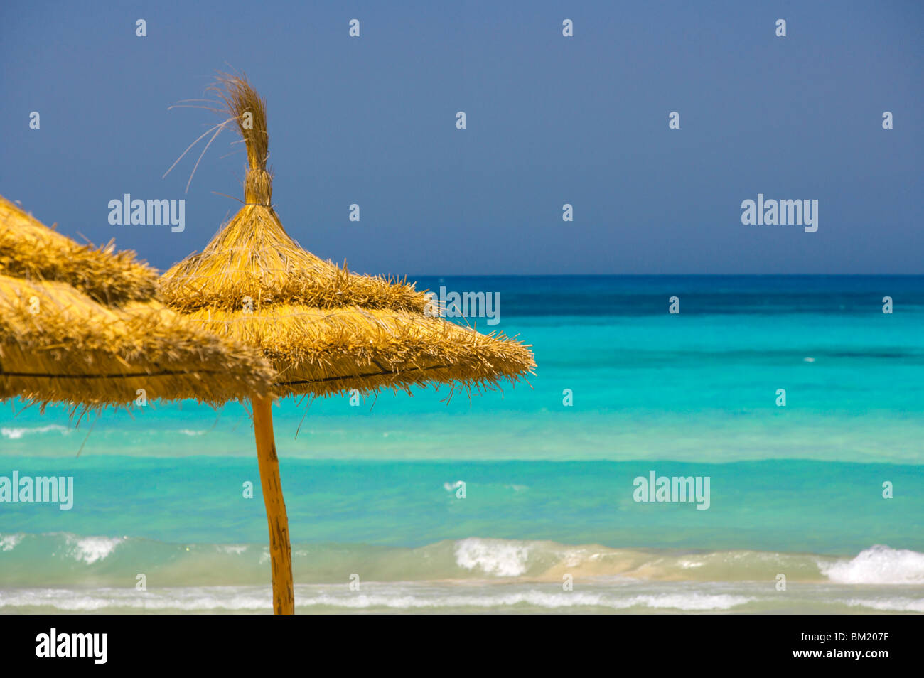 Parasols on beach, Rethymno, Crete, Greek Islands, Greece, Europe Stock Photo