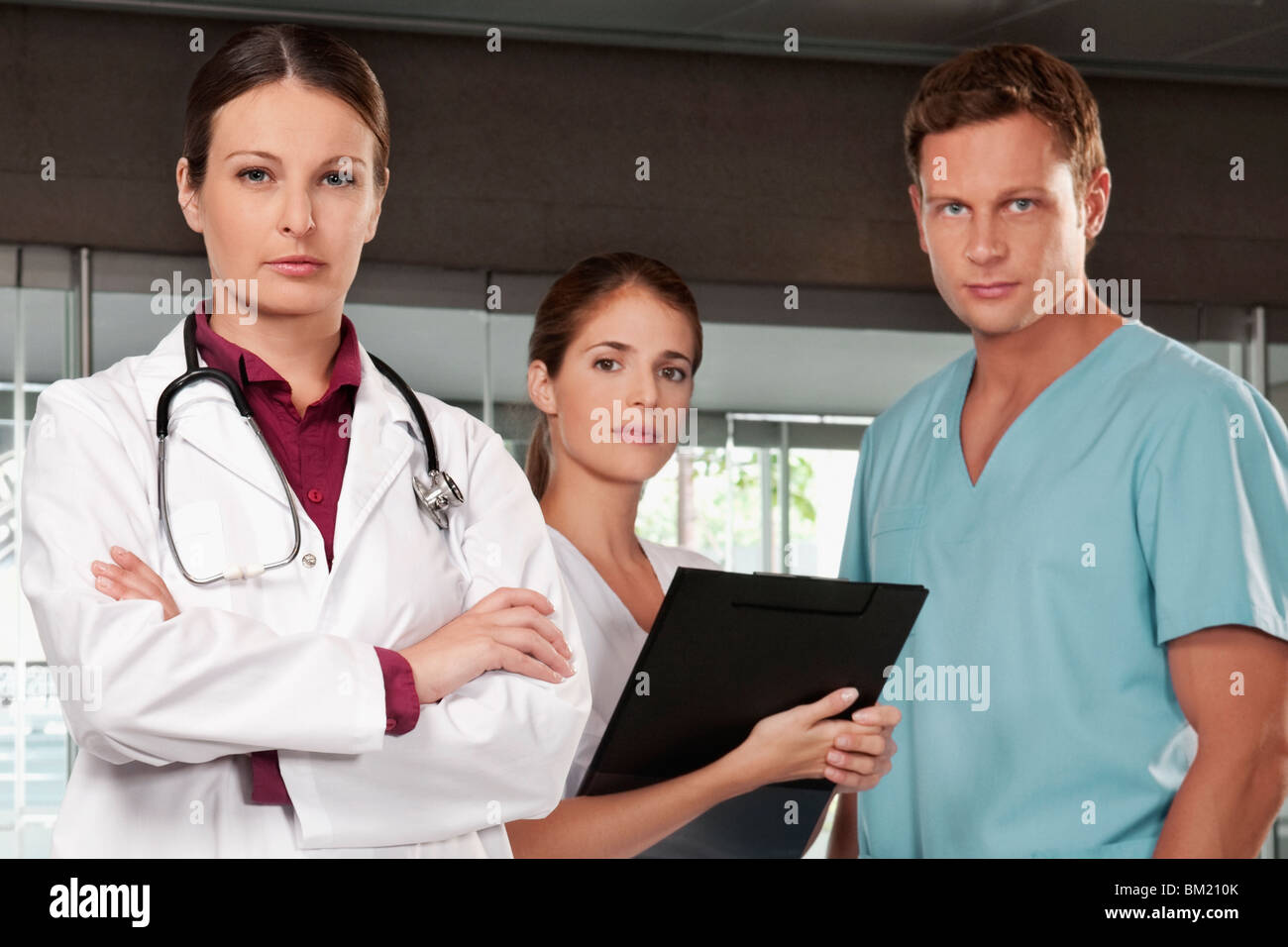 Three doctors standing together Stock Photo