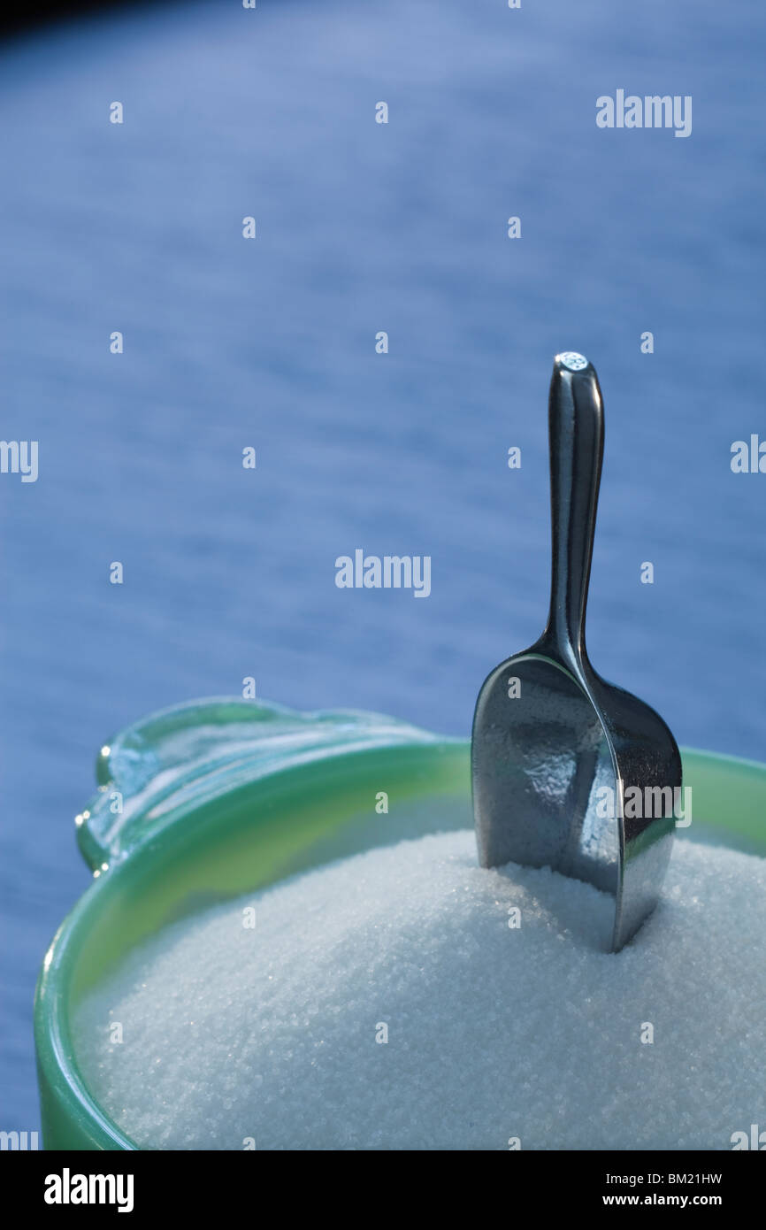 Green glass sugar bowl with mini scoop Stock Photo
