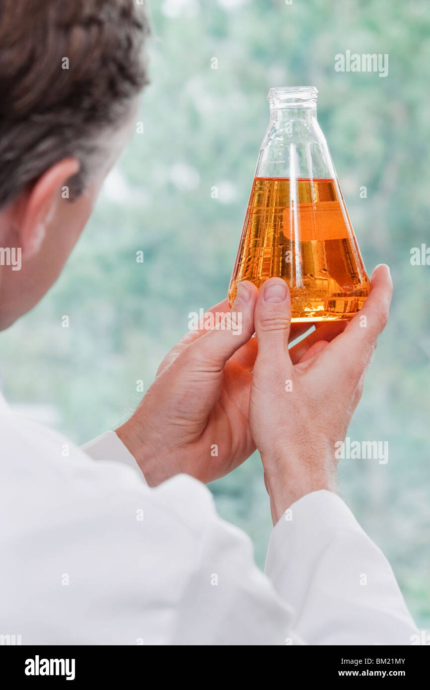 Doctor holding a conical flask in a laboratory Stock Photo