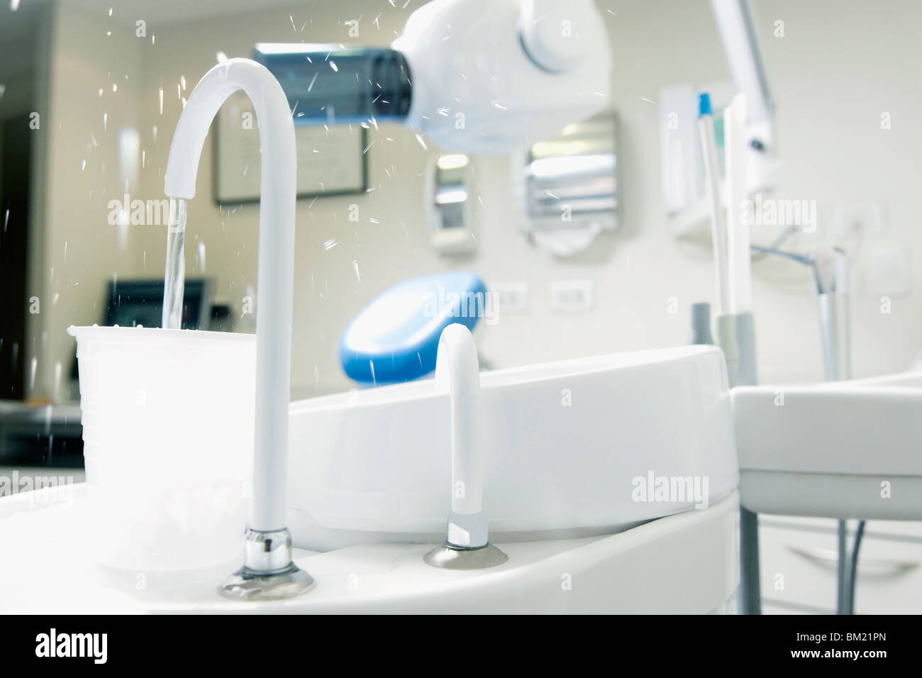 Dental cuspidor with a cup in an examination room Stock Photo Alamy