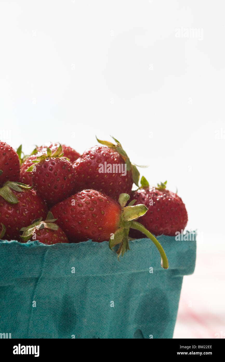 strawberries in green card board container Stock Photo