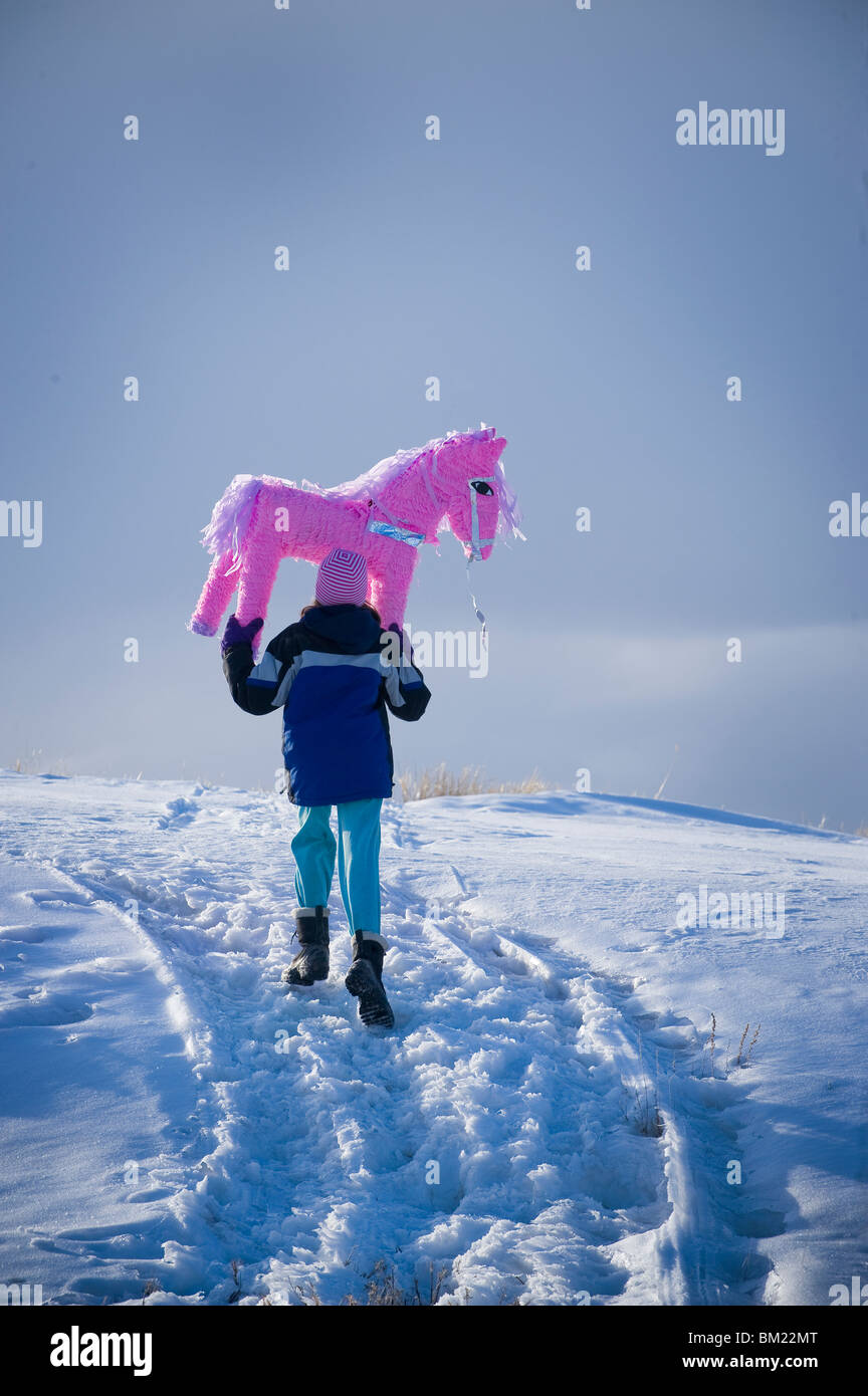 Rear view of a girl carrying a pink pony pinata, Bozeman, Montana, USA Stock Photo Alamy