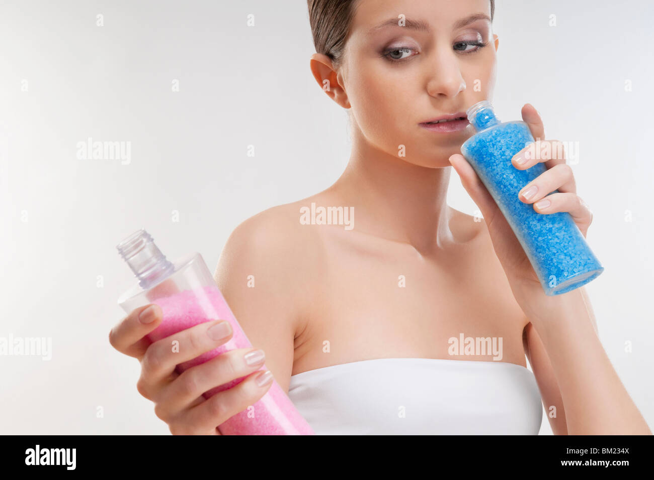Woman smelling bath crystals Stock Photo