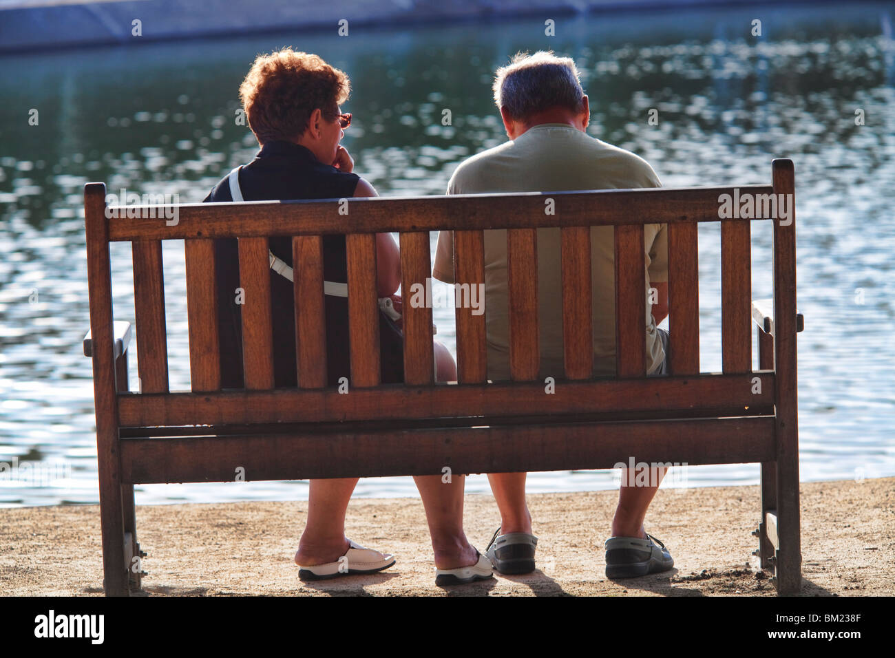 Senior couple sitting by the sea, Conleau island, town of Vannes, departament of Morbihan, region of Brittany, France Stock Photo