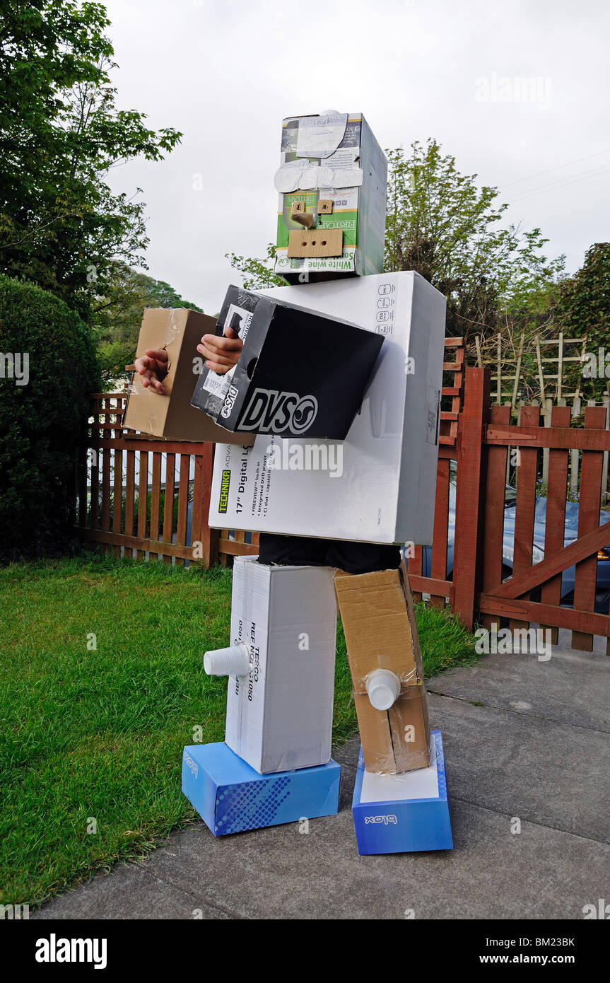 a child wearing a home made cardboard robot suit, uk Stock Photo