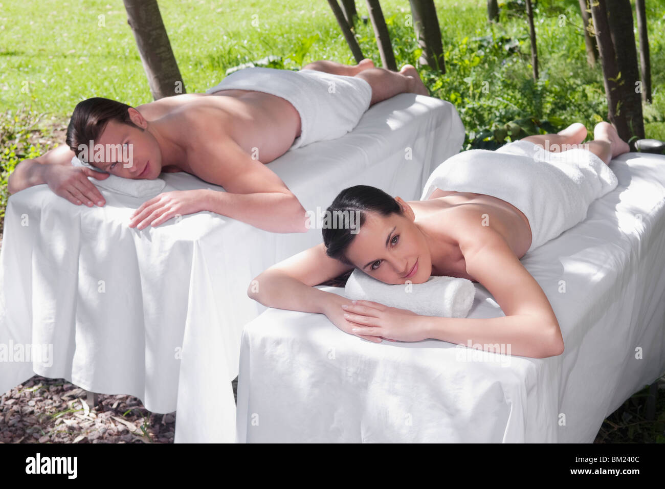 Couple lying on massage tables Stock Photo