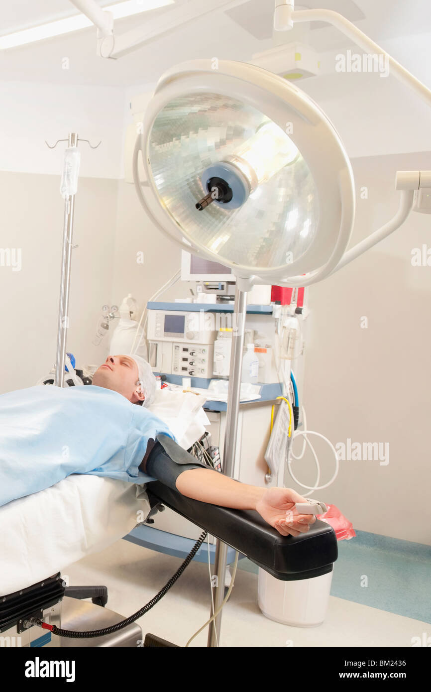 Patient lying on an operation table Stock Photo