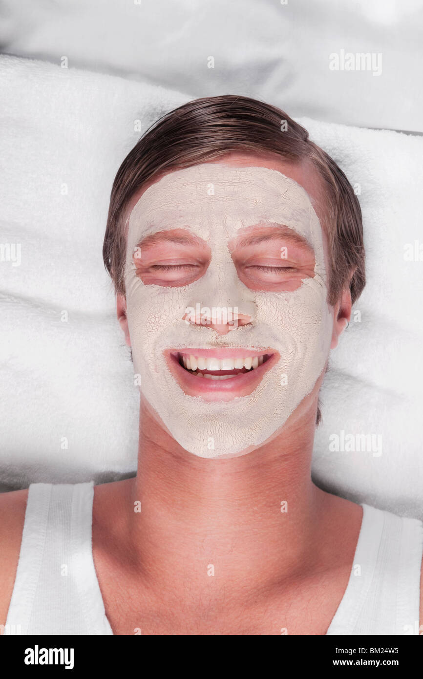 Man with face pack on his face Stock Photo