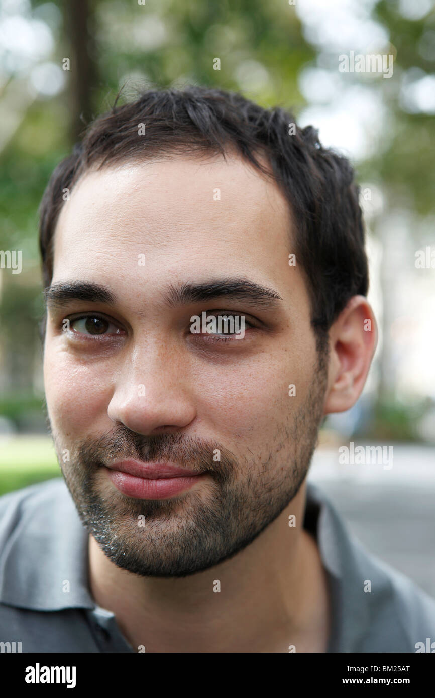 Portrait of a young man smiling Stock Photo - Alamy
