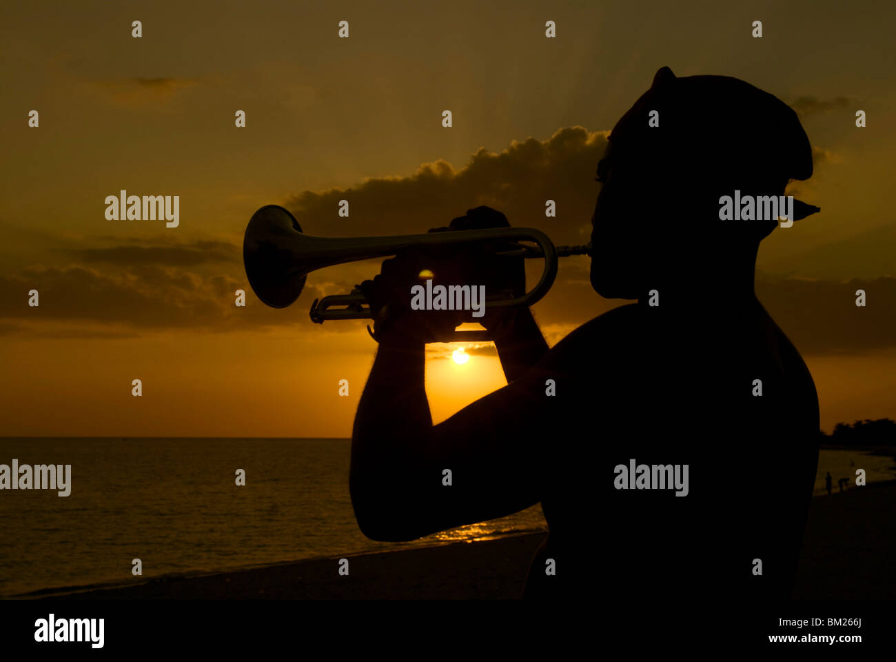 Actor playing the trumpet at sunset, Trinidad, Cuba, West Indies, Central America Stock Photo