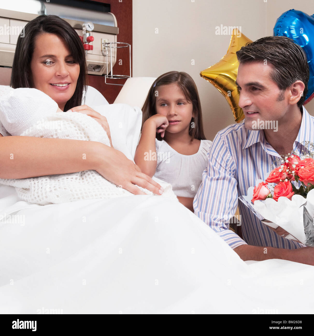 Couple with their newborn baby in a hospital Stock Photo Alamy
