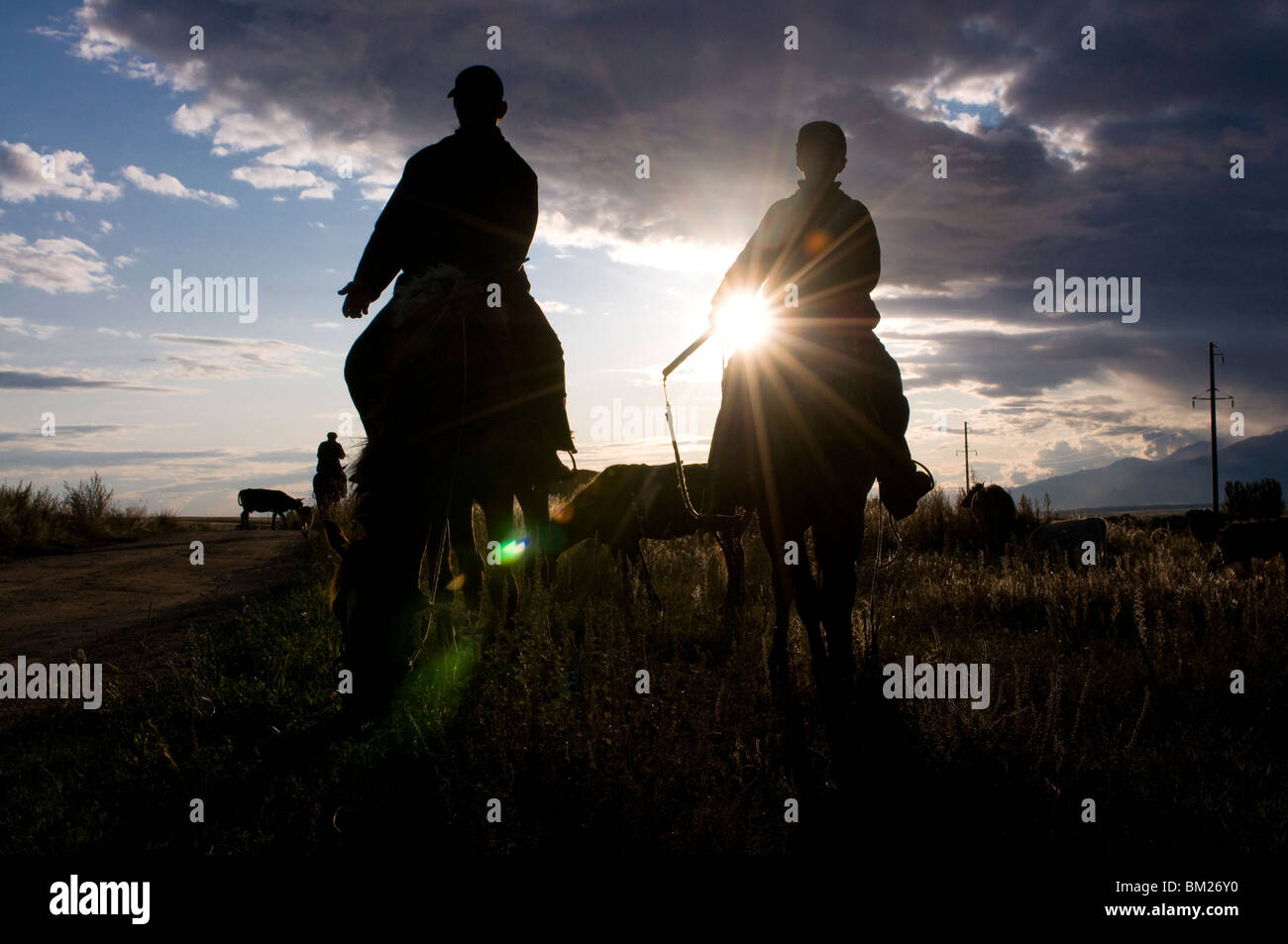 Silhouette of Kyrgyz herders, Karakol, Kyrgyzstan, Central Asia Stock Photo
