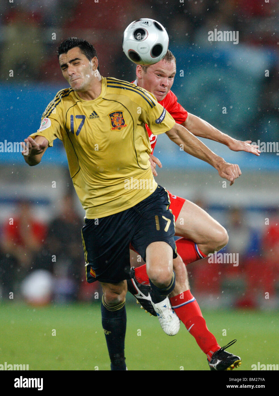 Daniel Güiza of Spain (l) and Aleksandr Anyukov (r) of Russia battle for the ball during a UEFA Euro 2008 semi-final match. Stock Photo