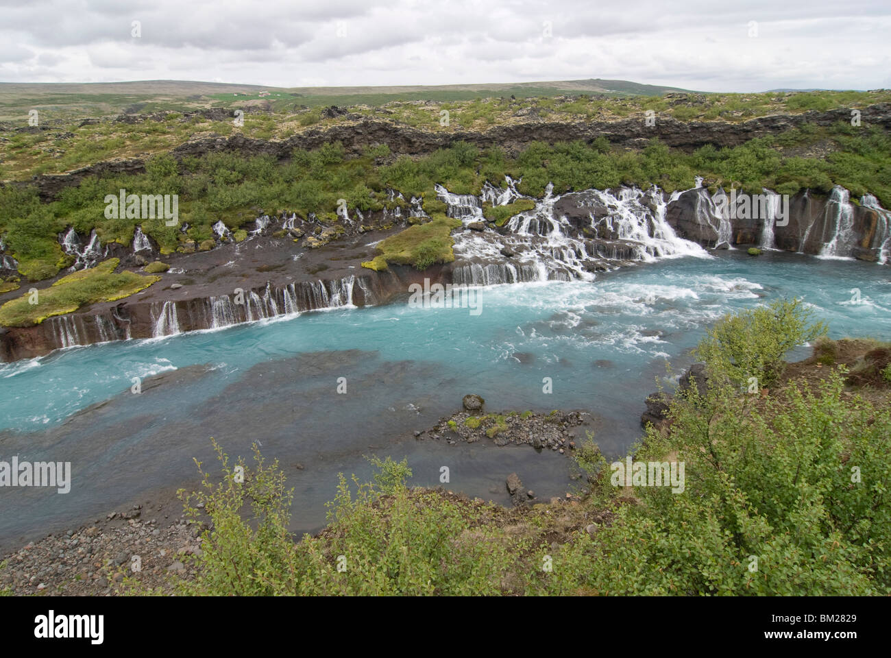 Waterfalls flowing down the rocks Hraunfossar, Iceland, Polar Regions Stock Photo