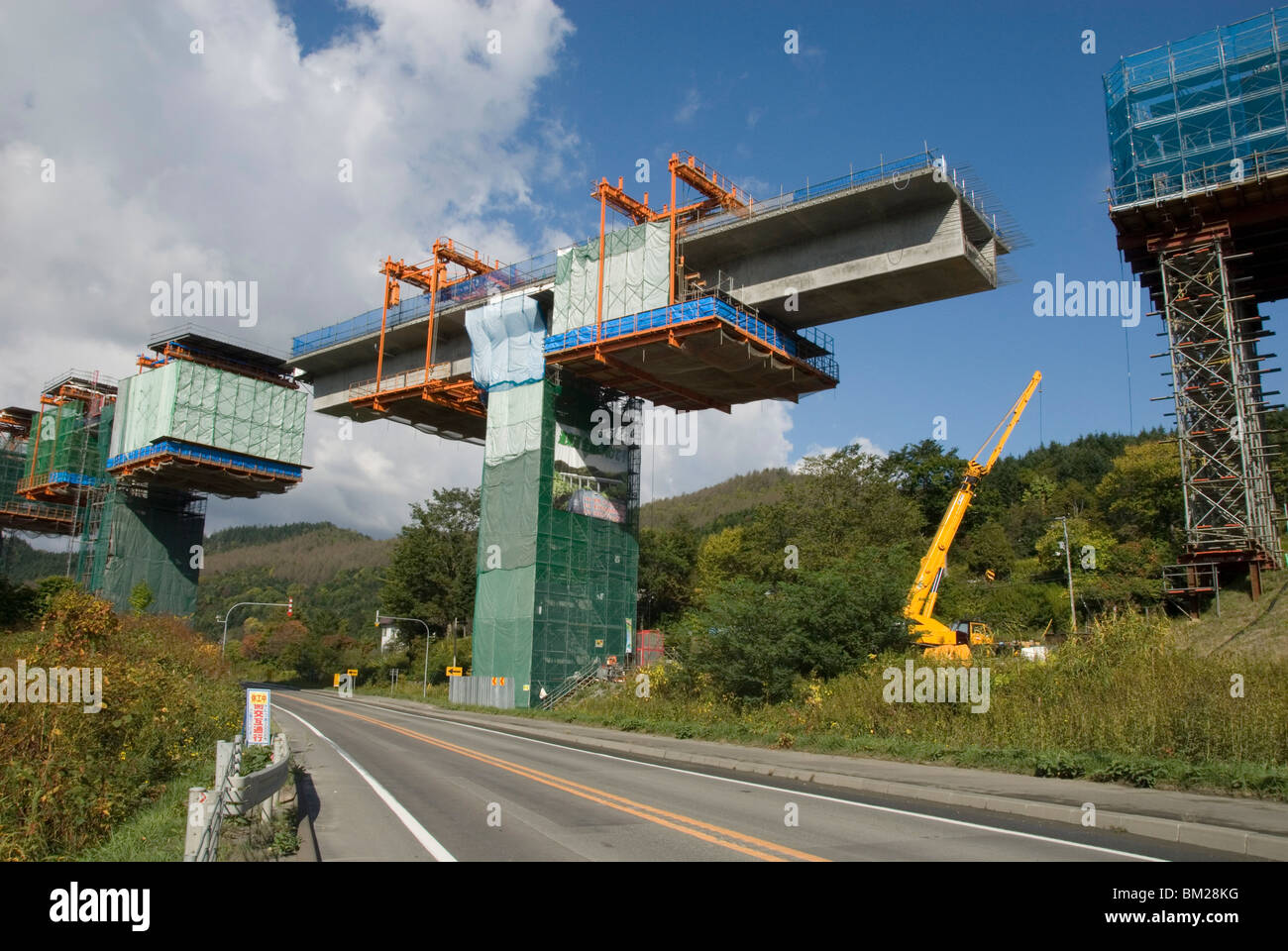 Construction of new viaduct near Hidaka, for freeway from Sapporo to Obihiro, across central Hokkaido, Japan Stock Photo