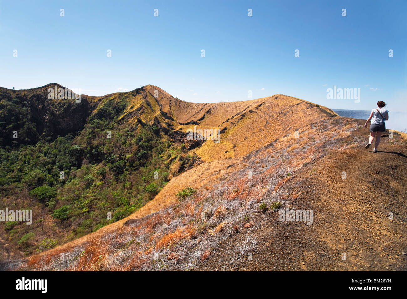 Tourist walks round Masaya crater, Santiago crater, Park National Volcan Masaya, Masaya, Nicaragua Stock Photo