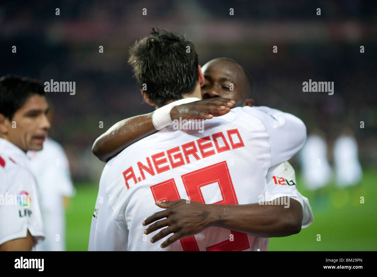 Zokora and Negredo hugging after a goal scoring. Stock Photo
