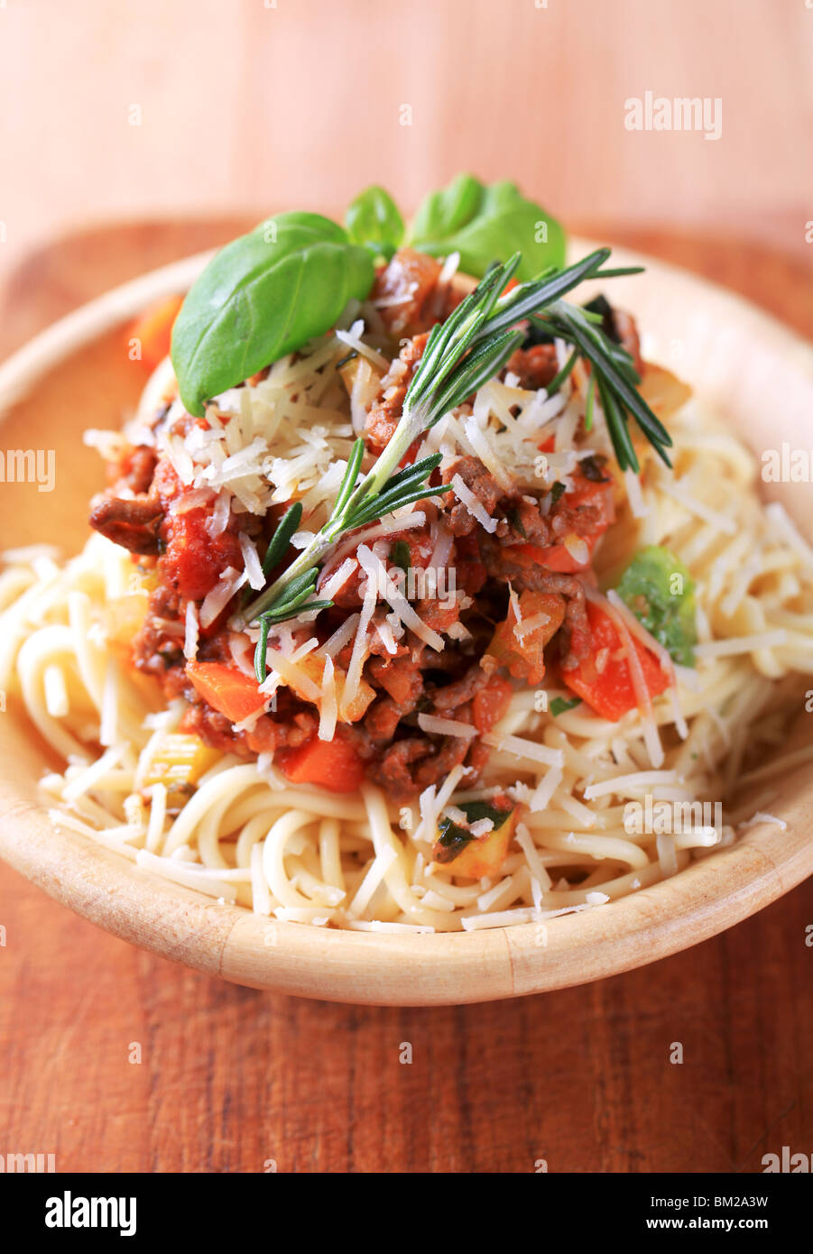 Bolognese sauce on a bed of spaghetti sprinkled with Parmesan Stock Photo