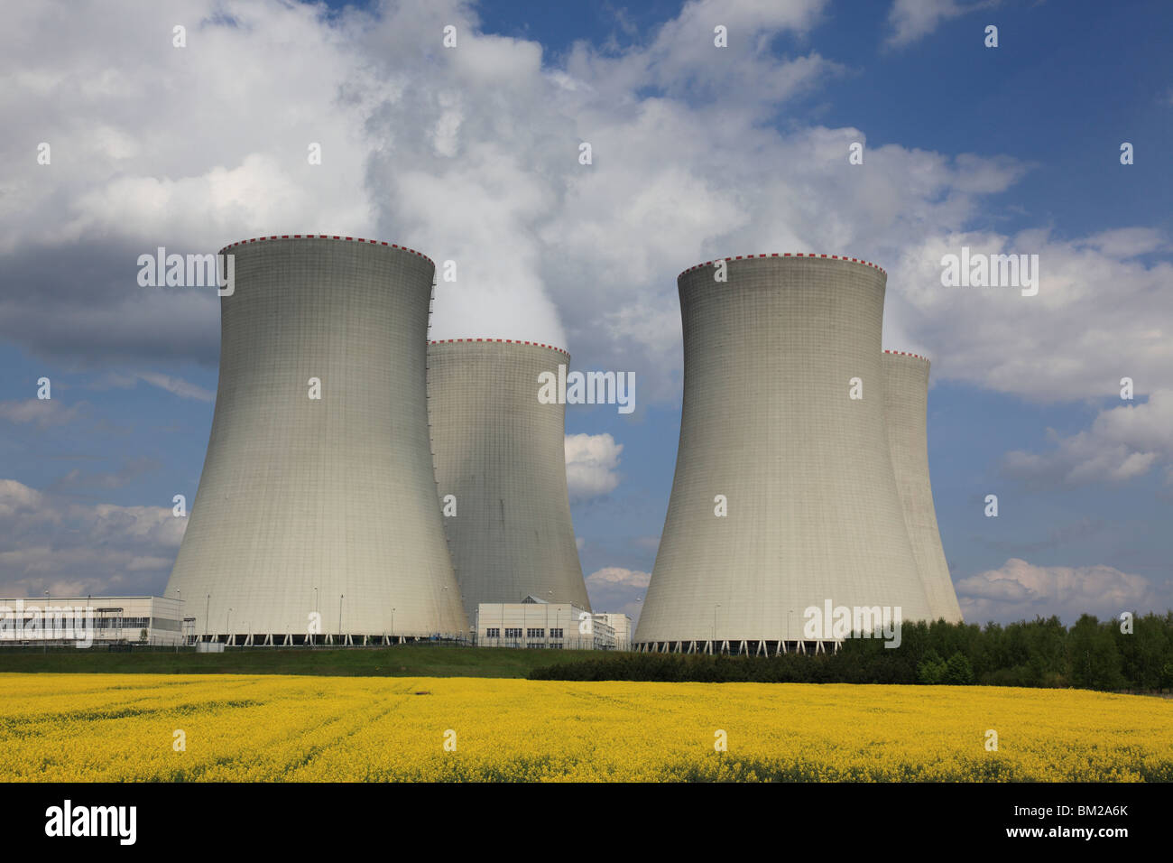 4 cooling towers of Temelin nuclear power plant in rape field, Czech ...