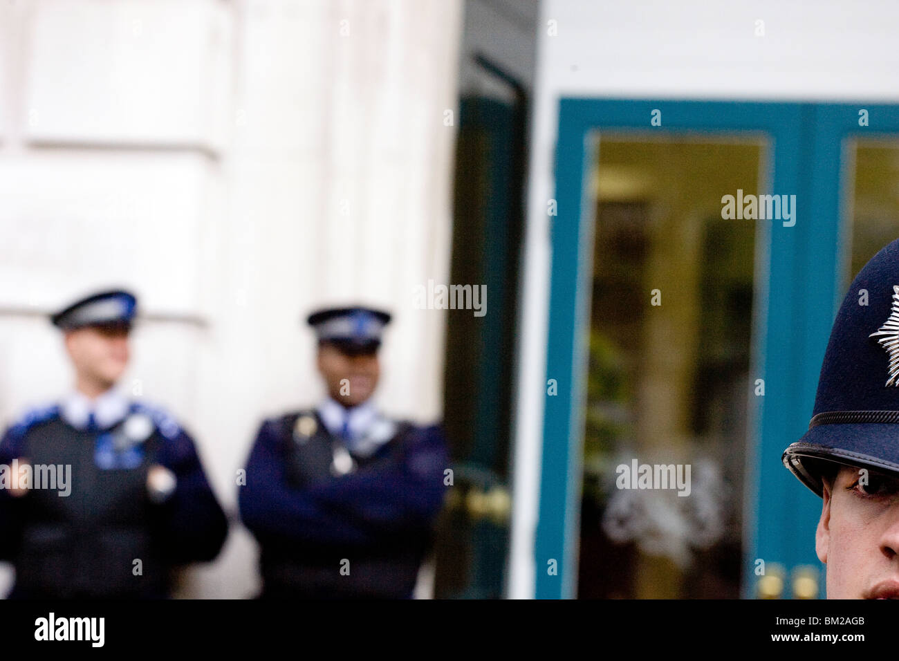 Met police waiting outside the Cabinet Office during Conservative and Lib Dem coalition talks after the 2010 election. Stock Photo
