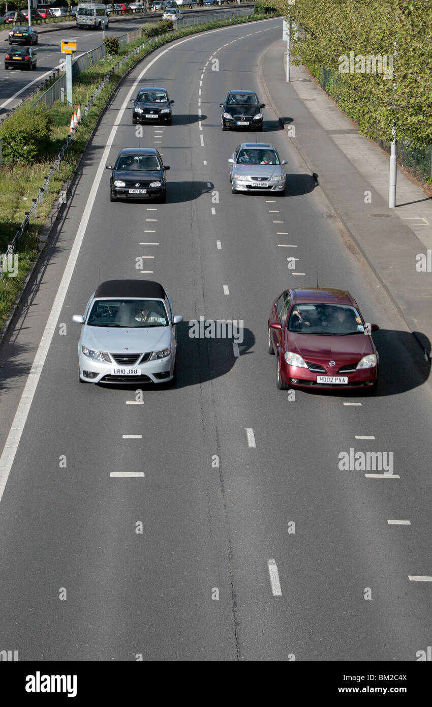 Cars bunching as they pass a Gatso speed camaera on the A316, Great