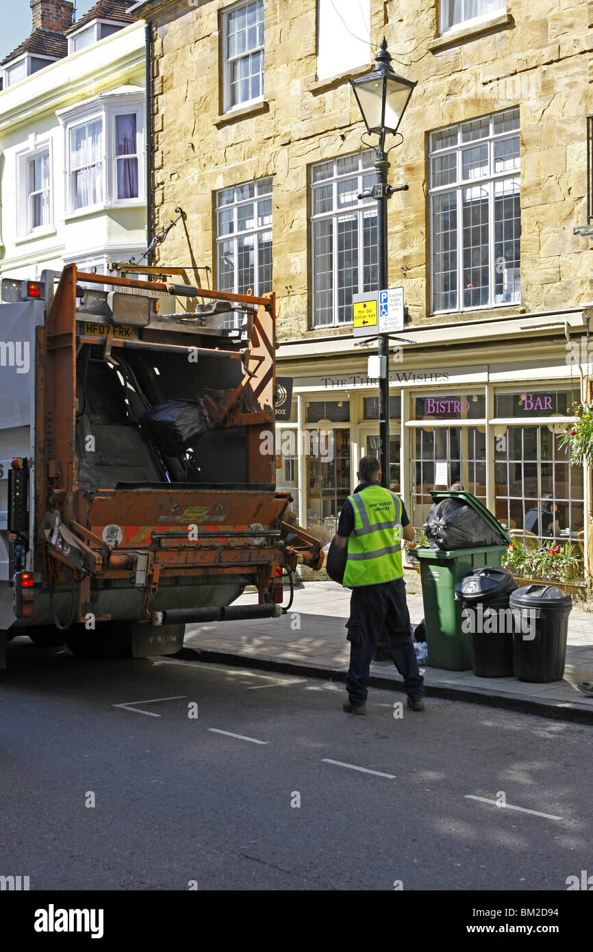 Dustbin men at work on Rubbish collection day in an English town Stock