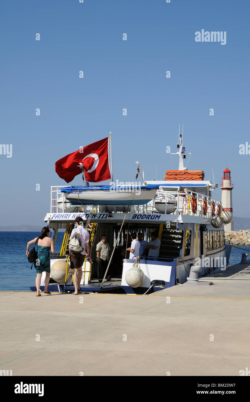 Passengers boarding the Fahri Kaptan III ferry at Turgutreis Marina Bodrum Turkey for the short Aegean Sea crossing to Kos GR Stock Photo
