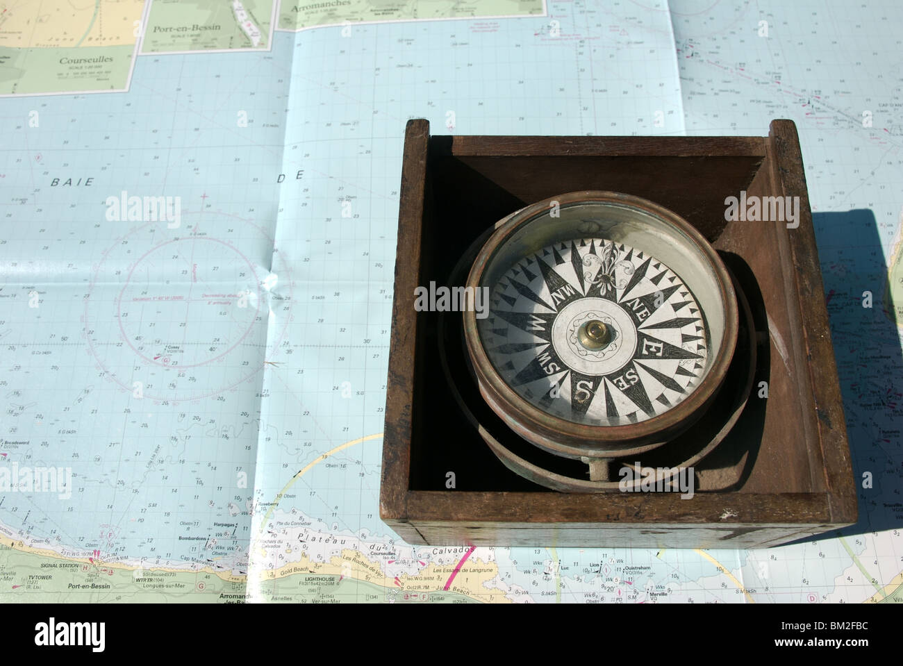 Nautical compass binnacle box on seachart background Stock Photo