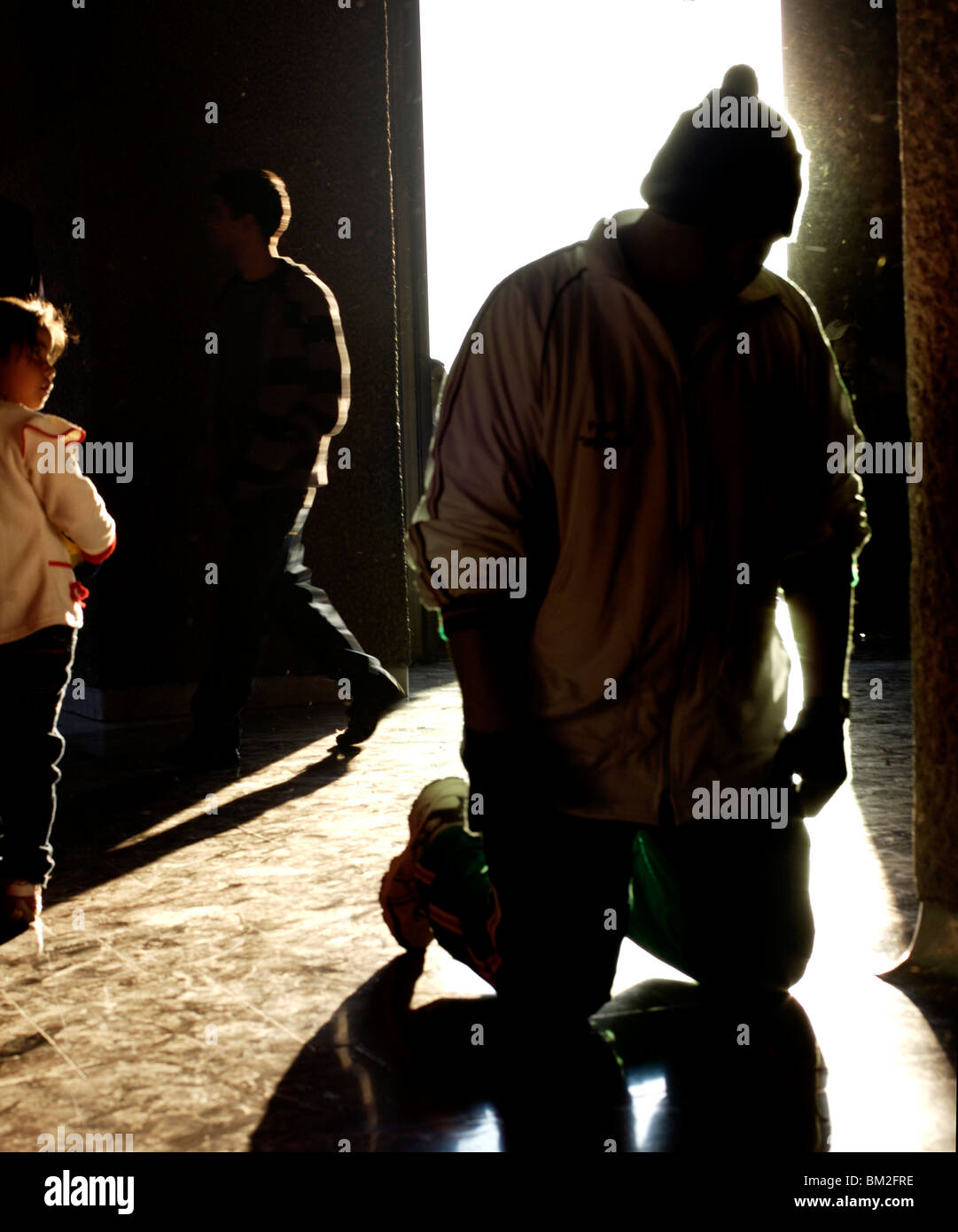 A pilgrim enters on his knees in the Basilica of Guadalupe in Mexico City, December 11, 2007. Stock Photo