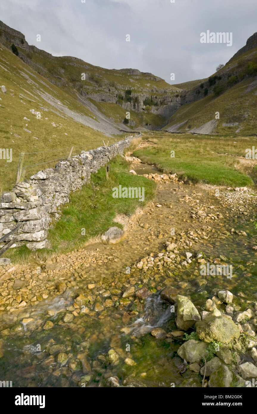 Entrance to Malham Cove with threatening clouds overhead, Yorkshire, UK Stock Photo