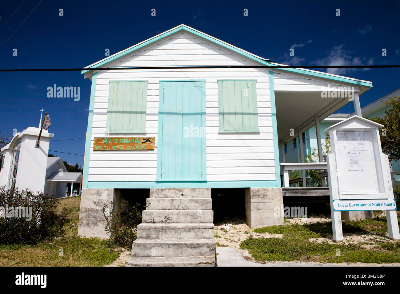 The quaint painted building of the local public library on Man O War ...