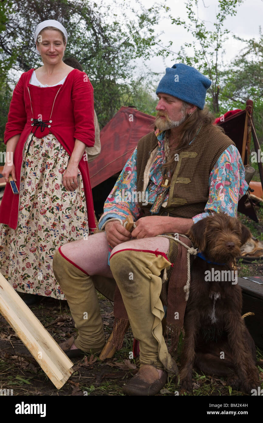 Tulip time festival Dutch Holland Michigan in USA .A couple of settlers Re-enactors dressed in authentic traditional costume a woman trade fair hi-res Stock Photo