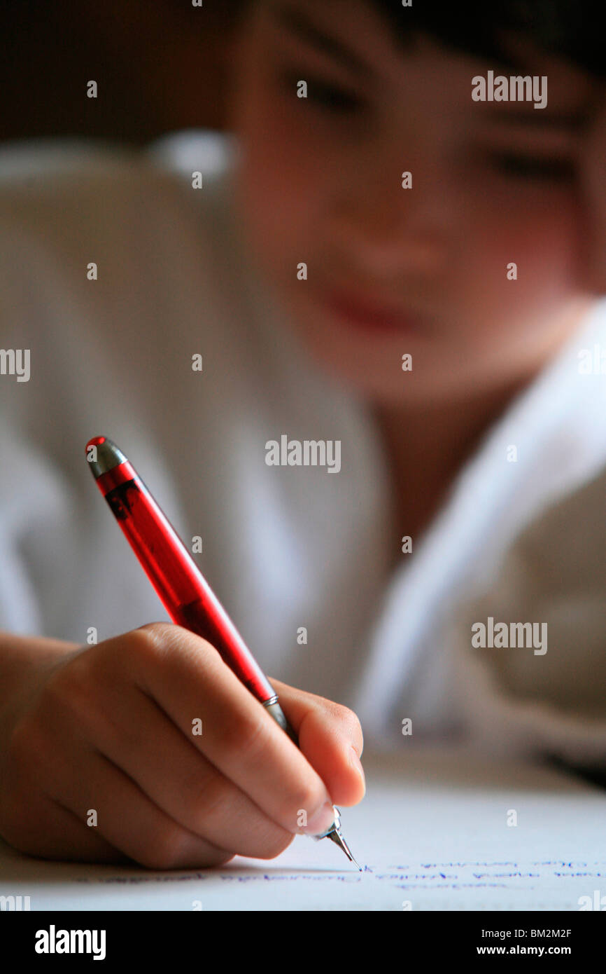 Boy writing a letter, France Stock Photo