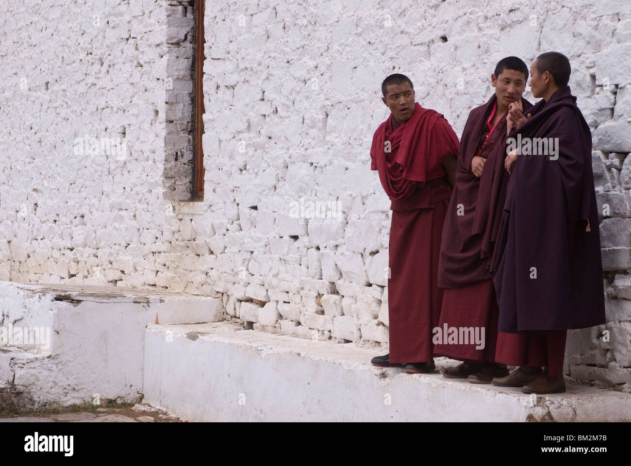 Young monks having a chat at the Paru Tsong a fortified monastery, Paru, Bhutan Stock Photo