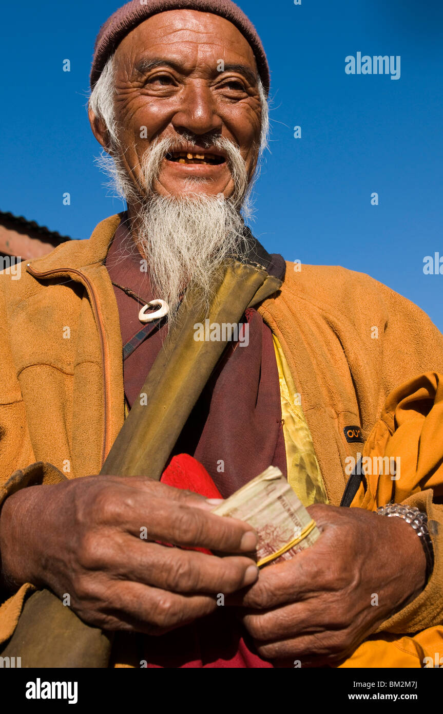 Portrait of a monk doing his morning shopping, Paro, Bhutan Stock Photo