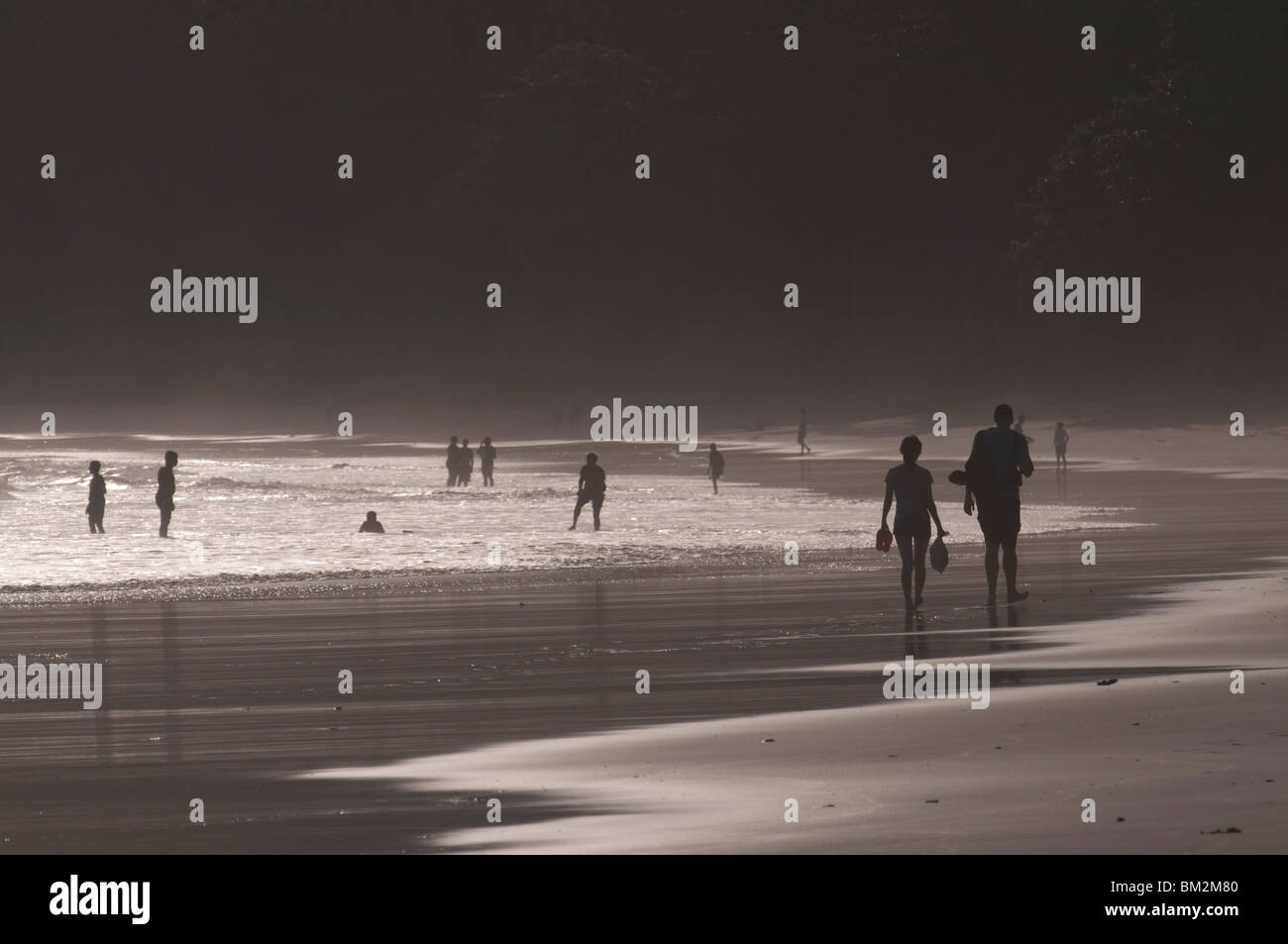 People walking along the wonderful Elephanta Beach in the dusk, Havelock Island, Andaman Islands, India, Indian Ocean Stock Photo