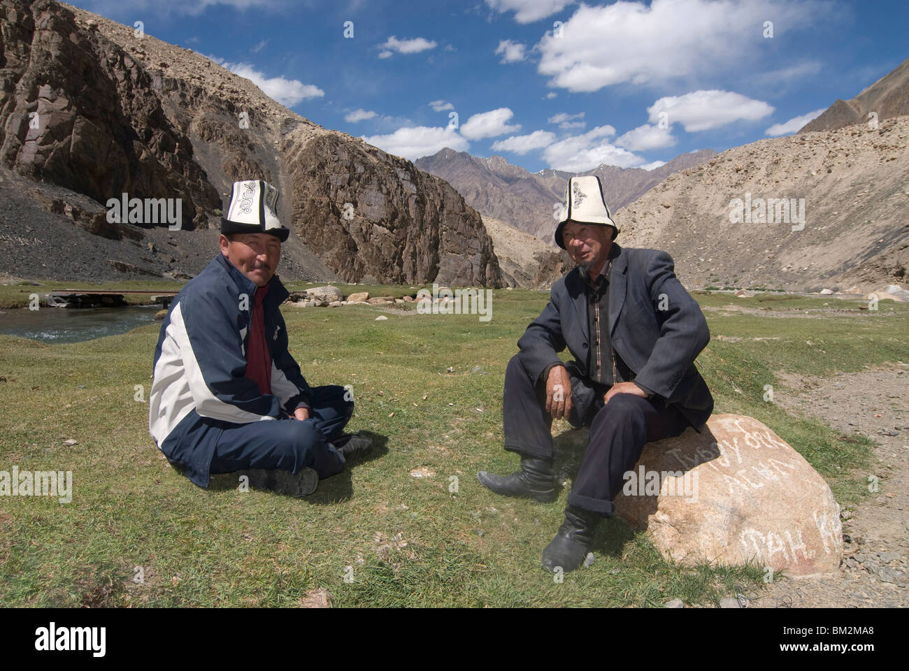 Ethnic Kyrgyz men, Madyian hot springs, The Pamirs, Tajikistan Stock Photo