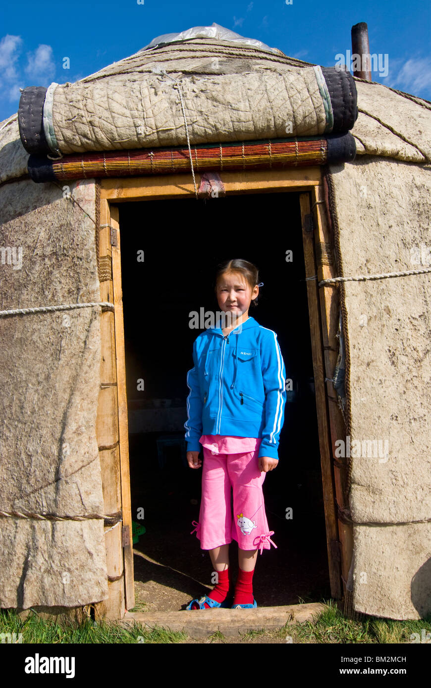 Child in yurt, tent of Nomads at Song Kol, Kyrgyzstan Stock Photo