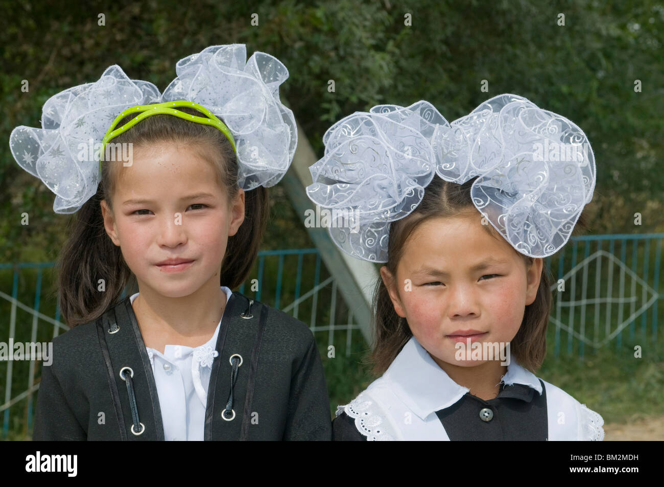 Portrait of girls in traditional clothes, Torugart, Kyrgyzstan Stock Photo
