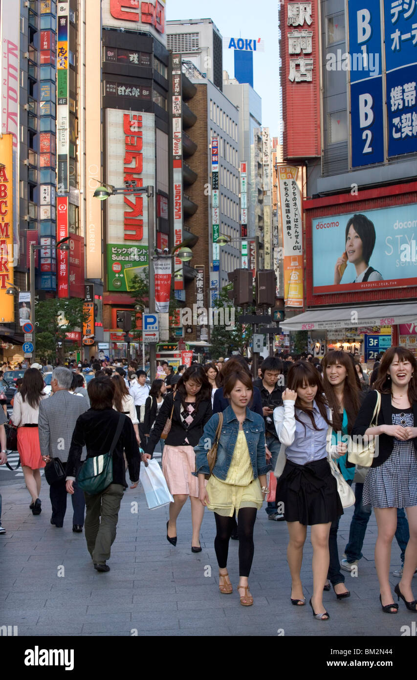 Busy shopping district along Shinjuku-dori Street near East Shinjuku train station, Tokyo, Japan Stock Photo