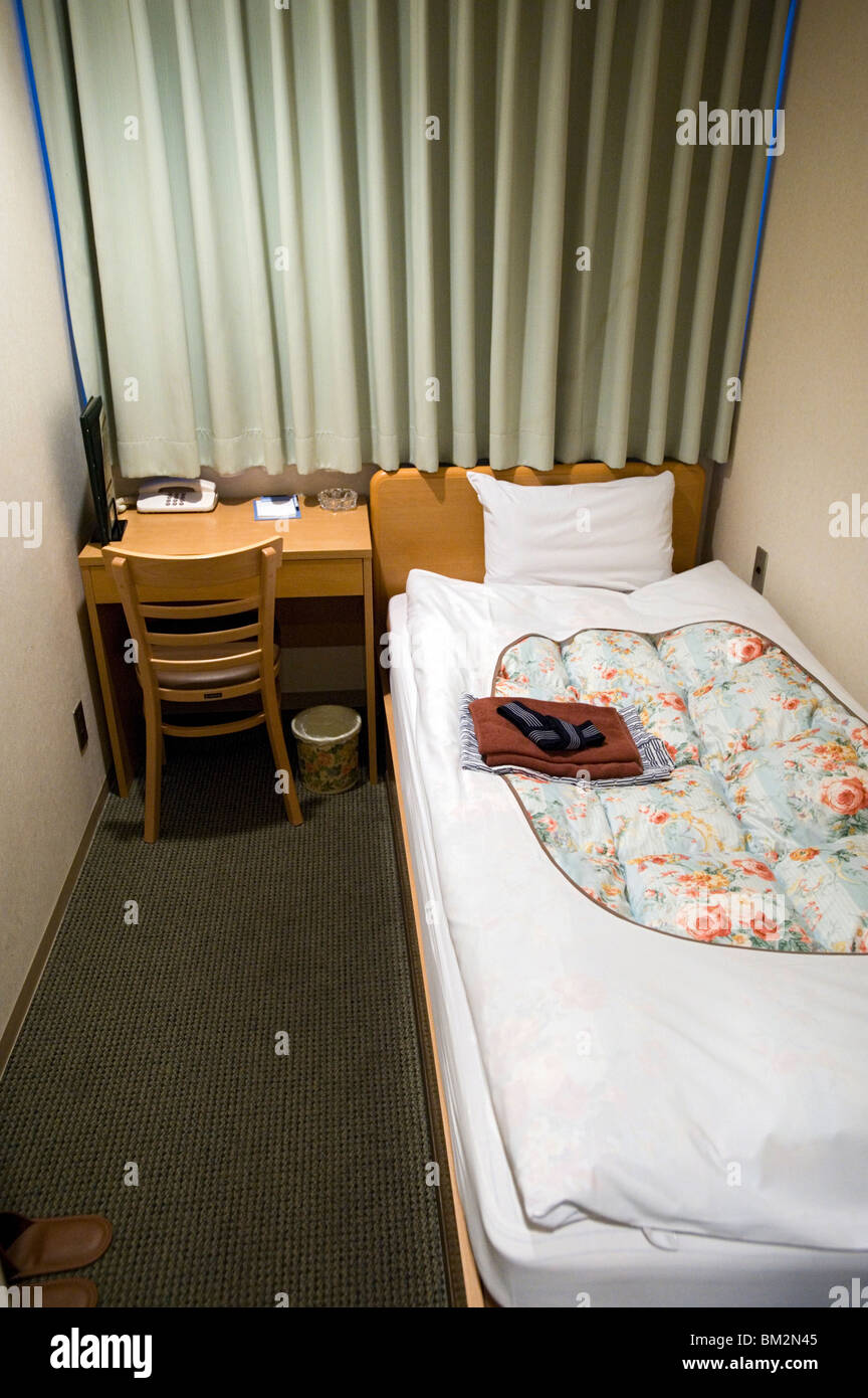 A shoebox-sized hotel room less than two metres wide and costing 8,000 Yen ($80.00)  in central Tokyo, Japan Stock Photo